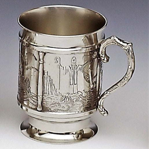 ST.PATRICK TANKARD tells the story of St. Patrick's life in Ireland. His captivity, life as a slave praying  while minding sheep, return to Ireland as a Priest and how he rid Ireland of its snakes. The tankard holds 18 fluid ozs and stands 4" tall. handmade in Ireland by Mullingar Pewter  