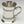 Load image into Gallery viewer, CELTIC STRIP TANKARD. The design is that of Celtic entwined knotwork. The tankard holds 18fluid ozs and stands 5&quot; tall. Hand made in Ireland of Cast pewter the tankard is both elegant and sturdy.
