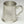 Load image into Gallery viewer, CROSS FLAG TANKARD. PINT TANKARD WITH CROSSED IRISH AND AMERICAN FLAGS. THE TANKARD HOLDS SO FLUID OZS AND STANDS 4 1/2&quot; TALL. HANDMADE IN IRELAND
