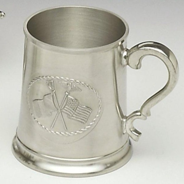 CROSS FLAG TANKARD. PINT TANKARD WITH CROSSED IRISH AND AMERICAN FLAGS. THE TANKARD HOLDS SO FLUID OZS AND STANDS 4 1/2" TALL. HANDMADE IN IRELAND