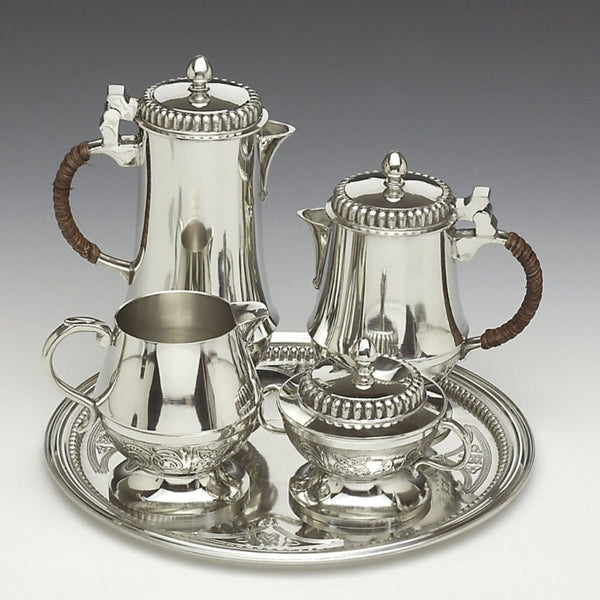 Limited Edition Mullingar Pewter heirloom tea and coffee set with Celtic design, including teapot, coffee pot, creamer, sugar bowl and serving tray.