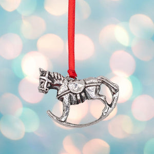 Rocking horse christmas tree decoration made of silver coloured Pewter on a red ribbon.