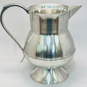 IRISH PEWTER WATER JUG GIVEN A SOFT SILVER POLISH TO FINISH THE METAL. Stands about 8" tall and has a capacity of about 2 pints. Sturdy and strong with great design.