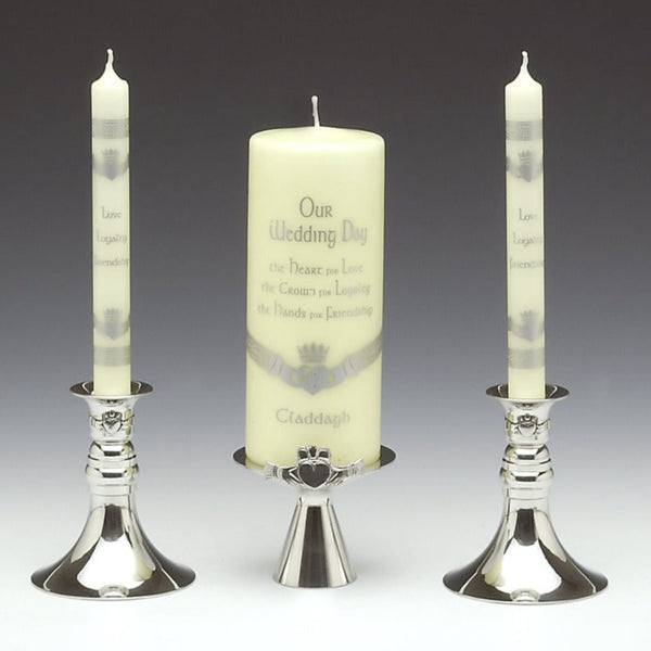 WEDDING CLADDAGH CANDLE HOLDER SET . This three piece set is made up of a large candle holder in the centre with Claddagh attaced and then two taller candle holders on either side  to hold  two tapper candles. The perfect engagement gift al adorned with the Claddagh. The three piece is polished to a silverware finish and can be so easily used after a wedding. The two single tapper candle holders stand at 5" tall and the large candle holder stands at 3" tall Made in Ireland by Mullingar Pewter