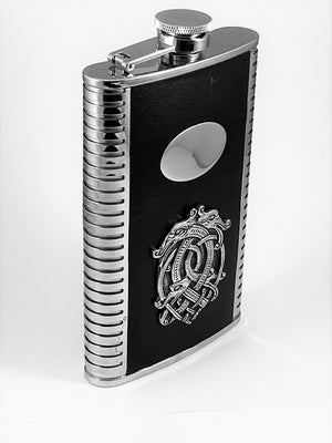 9OZ WHISKEY FLASK WITH CELTIC DRAGON AND ENGRAVABLE. Great gift to personalize. The flask has a capacity of 9 fluid ozs and stands at 6" tall. The hip shape sits great in a hip pocket. Stainless steel flask with black leather surround and Pewter Celtic Dragon design. made in Ireland by Mullingar Pewter