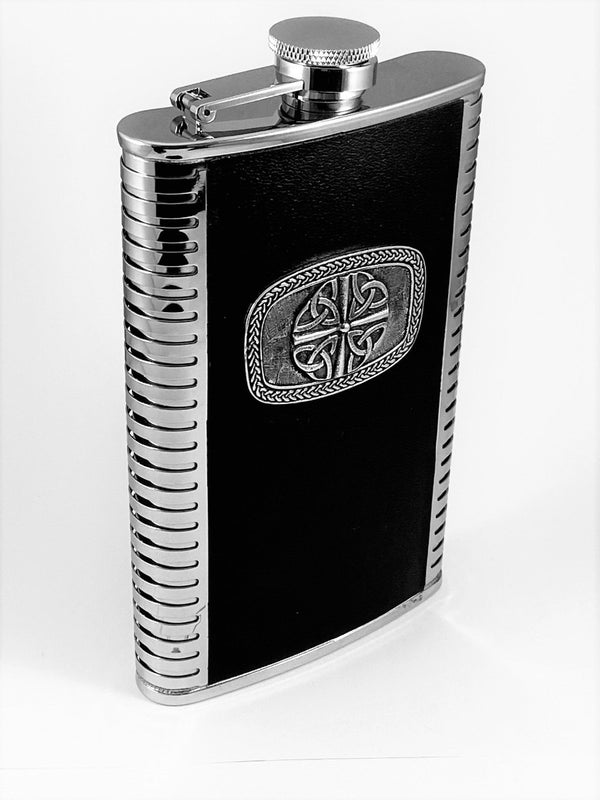 9OZ WHISKEY FLASK WITH TRINITY 4 DESIGN. the 6" tall flask has the 4 trinity shield  embossed on the front. The stainless steel, black leather and pewter combination make a great item. made in Ireland, by Mullingar Pewter.