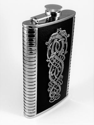 9OZ WHISKEY FLASK CELTIC DRAGON DESIGN ON BLACK LEATHER. Just a great flask standing at 6" tall and sure to satisfy any body as a great gift. The Celtic Dragon design is fixed to the front of the flask and looks so well against the black leather back ground. The flask is stainless steel and the pewter design is polished finish. Made in Ireland by Mullingar Pewter