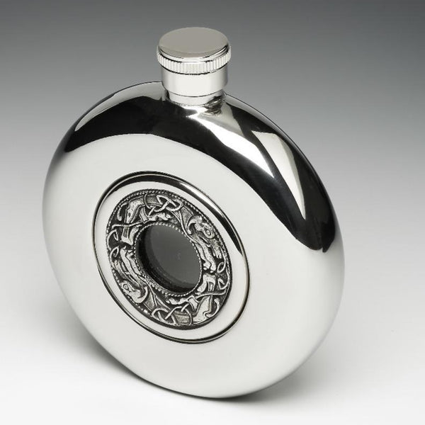 WHISKEY FLASK WITH KELLS DESIGN. This 5 fluid oz flask is finished to a high silverware finish.  The flask is 4" tall and fits great in a bag or pocket. The glass center allows one to see how full the flask is and the pewter decoration around the Glass is Celtic dog design from  old Irish Manuscript. Made in Ireland by Mullingar Pewter