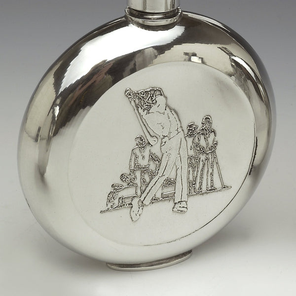 PEWTER ROUND GOLFER FLASK. A Cast pewter flask with a golf scene on one side of the flask. pewter polished to a silverware finish. Handmade in Ireland