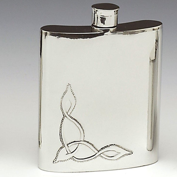 PEWTER WHISKEY FLASK 6OZ. THIS CAST PEWTER FLASK IS A 6 FLUID OZ FLASK STANDS AT 4" TALL AND IS EMBOSSED WITH A CELTIC KNOT DESIGN. tHE CAST PEWTER MAKES FOR A STURDY FLASK AND IS POLISHED TO A SILVER FINISH. HANDMADE IN IRELAND