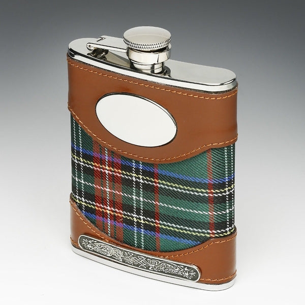 WHISKEY FLASK TARTAN AND LEATHER COVERED. The flask stands at 4" tall and holds 6 fluid ozs. This piece can be personalized. The base is embossed with a pewter Celtic strip. The cap is fixed to the flask for safety. By Mullingar Pewter