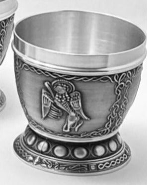 WHISKEY TUMBLER MARK THE LION. THIS DESIGN INSPIRED BY THE BOOK OF KELLS IS OF MARK WHO WAS REPRESENTED IN THE BOOK BY THE MONKS OF THE TIME AS A LION. THE DETAIL IS CAPTURED FULLY IN THIS BEAUTIFUL TUMBLER AND MAKES A GREAT WHISKEY TUMBLER. THE CUP IS SURROUNDED BY CELTIC DESIGN OF UNIQUE NATURE. PEWTER SILVER POLISHED FINISH