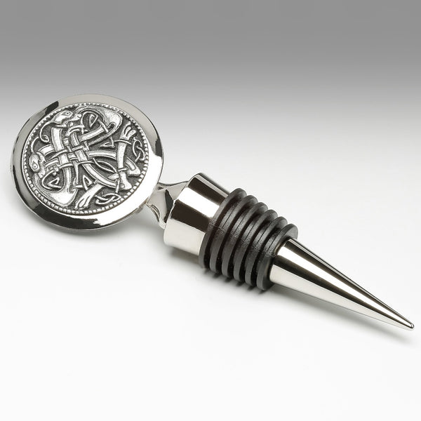 WINE BOTTLE STOPPER WITH CELTIC INTERLACE. THE DESIGN IS FOUND ON MANY OF IRELANDS CELTIC CROSSES THROUGHOUT IRELAND. THE STOPPER IS 4 1/2" LONG. MADE IN IRELAND