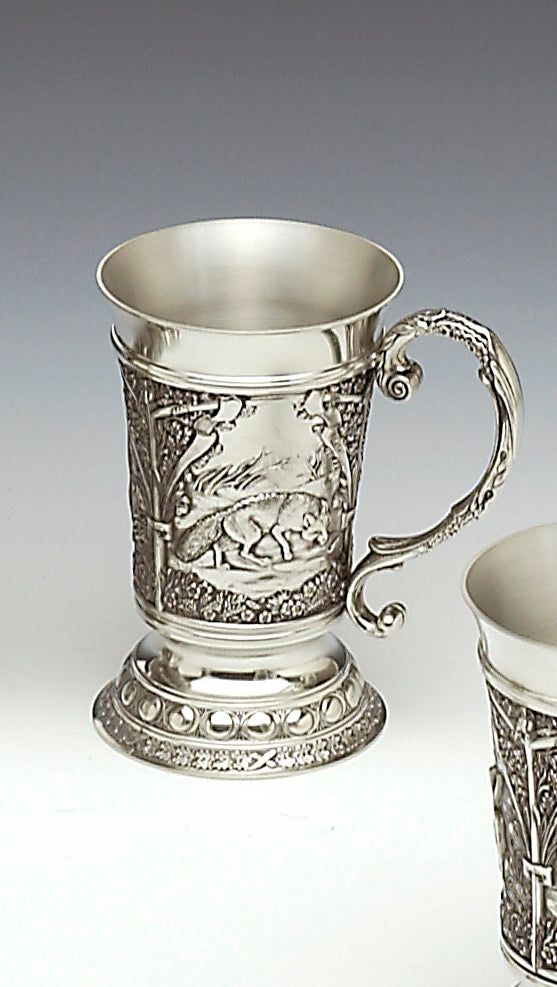 Pewter woodland tankards handcrafted with woodlands scenes - this is one is embossed with a fox. The tankard has a decorated handle and the capacity of the tankard is 12 fluid oz and stands 5 1/2" tall. Handmade in Ireland by Mullingar Pewter.