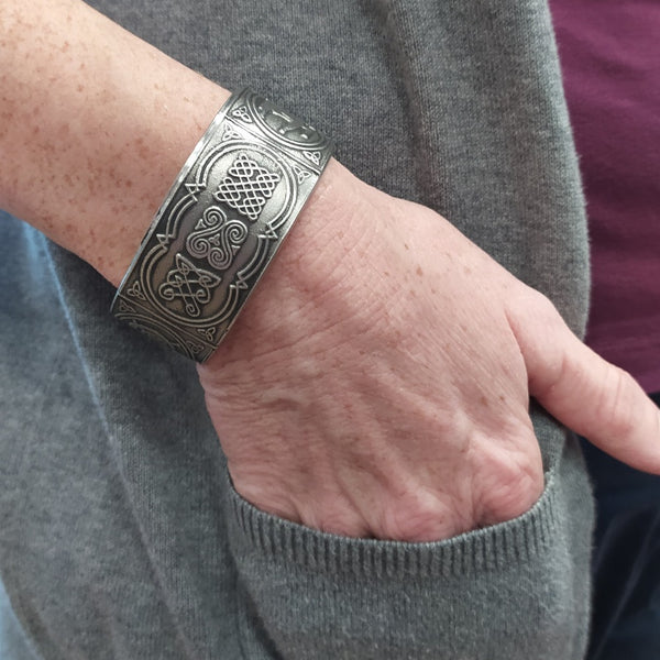 beautiful handcrafted pewter bangle bracelet with delicate Celtic knot work. in a silver finish