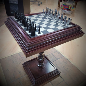 Pedastal Chess table made of red mahogany with the Brian Boru pewter Chess set from Mullingar Pewter