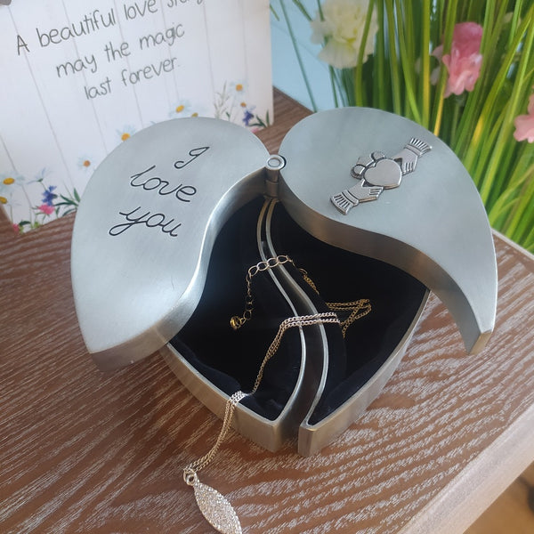 Heart shaped Jewellery box with engraved I love you and a claddagh motif embellishment, open in photo with a necklace and a saying card  A beatiful love Story