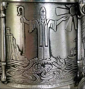 Detail of the St Patrick tankards . Patrick is banishing the snakes from Ireland