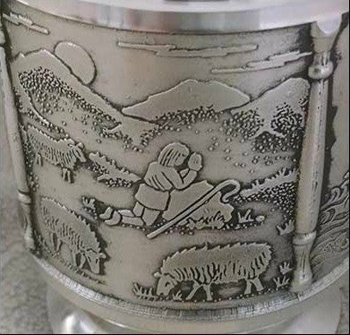 St. Patrick is praying in a field with sheep on the St. Patrick's Tankard made of Pewter