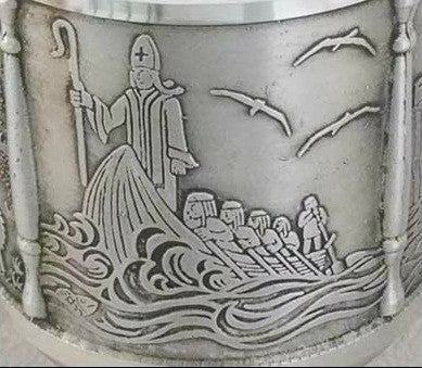 Detail of St. Patricks Tankard with St. Patrick in a boat with others on his return to Ireland