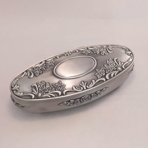 Rose embellished jewllry box with an area plain for engraving. Great to be able to add that special message for a loved one. Pewter silverware polished soft sheen finish.