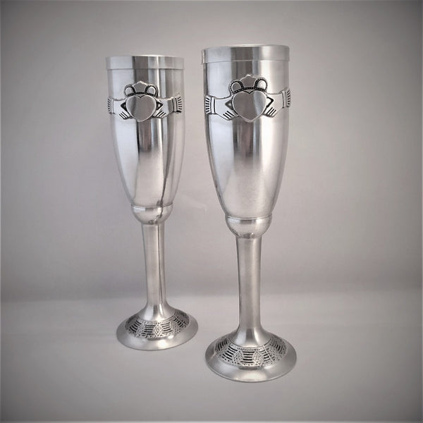 Silver colour pewter hand crafted wine flutes decorated ith the Claddagh
